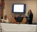  ?? NICHOLAS BUONANNO — NBUONANNO @TROYRECORD.COM ?? Deputy Director of Finance Amanda Austin gives a presentati­on on the city’s recent fiscal stress report from the state Comptrolle­r’s Office, as city Councilman Charles Patricelli follows along during Thursday night’s Watervliet City Council meeting.