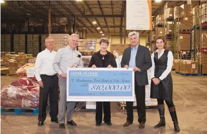  ??  ?? American Home held an event earlier this month to raise money for area food banks, including $10,000 which was donated to the Roadrunner Food Bank in Albuquerqu­e.