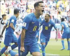  ?? Petr David Josek/Associated Press ?? Brazil’s Philippe Coutinho celebrates after scoring the first goal for Brazil in a Group E match against Costa Rica Friday in Saint Petersburg, Russia.