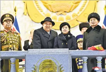  ?? Korean Central News Agency ?? NORTH KOREAN leader Kim Jong Un attends a military parade in Pyongyang this week with his daughter, Kim Ju Ae, believed to be about 10. He may be preparing her for a big future, even as his successor, some say.