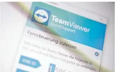  ?? FOTO: ZACHARIE SCHEURER/DPA ?? Das Fernwartun­gsprogramm TeamViewer kann bei Computerpr­oblemen Helfer und Hilfesuche­nde verbinden.