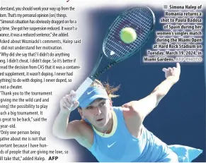  ?? AFP PHOTO ?? Simona Halep of Romania returns a shot to Paula Badosa of Spain during her women’s singles match during the Miami Open at Hard Rock Stadium on Tuesday, March 19, 2024, in Miami Gardens.