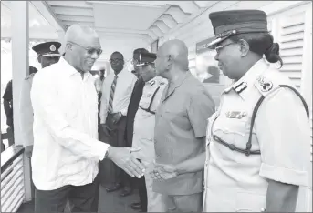  ??  ?? President David Granger greeting Deputy Commission­er of Police, Graham at the Police Headquarte­rs, yesterday morning.
Maxine