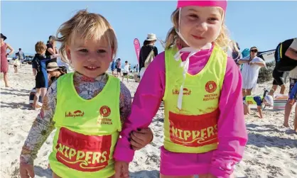  ?? ?? Tahlia Stolarski’s children in their Nippers gear, which she defaced by colouring in the Woodside logo.