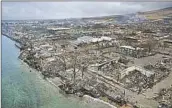  ?? PATRICK T. FALLON AFP/Getty Images ?? DESTROYED homes and businesses are seen near Lahaina’s waterfront on the island of Maui Aug. 10.