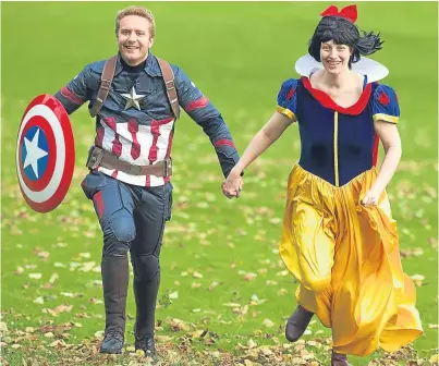  ?? Pictures: Daily Record. ?? James Innes Cameron and Bee Parkinson are comic book fans and James went down on one knee to propose to Bee at Comic Con in Glasgow.