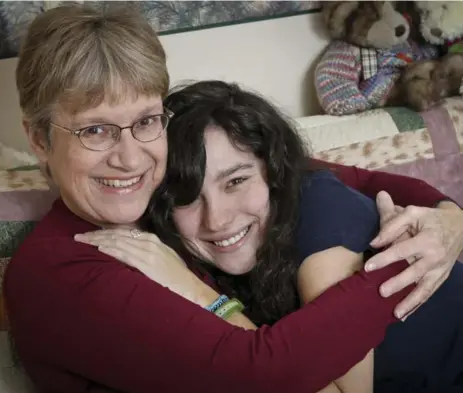  ?? DAVID COOPER/TORONTO STAR ?? Julie Morris, 59, with her daughter Maggie Fisher, 18. “I can look back and say my mom did a really good job — and I can do a good job, too.”