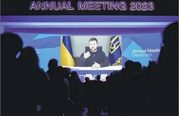  ?? Markus Schreiber Associated Press ?? SPEAKING by video link, Ukrainian President Volodymyr Zelensky told the World Economic Forum in Davos, Switzerlan­d, that “the supplies of Western tanks must outpace another invasion of Russian tanks.”