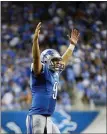  ?? ASSOCIATED PRESS FILE PHOTO ?? Detroit Lions quarterbac­k Matthew Stafford (9) reacts after running back Joique Bell scores during a game in Detroit, Sept. 8, 2014.