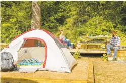  ?? DAM ARMSTRONG VIA THE NEW YORK TIMES ?? A Kampground­s of America campsite in Cherokee, N.C., just outside Great Smoky Mountains National Park. With a new wave of campers comes Wi-Fi, plush robes and apps that make booking a campsite as easy as calling an Uber.