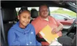  ?? CHARLES PRITCHARD — ONEIDA DAILY DISPATCH ?? Destiny Williams, 15, and Thomas Adamo get ready to leave for Verona after Williams got off the bus from New York City on Thursday, Aug. 16, 2018.