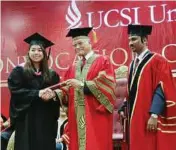  ??  ?? Jubilant: Lea Ngar receiving her scroll during the convocatio­n.