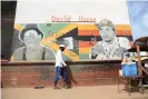  ?? Photograph: Nyasha Chingono ?? A mural of popular Zimdanceha­ll artists in Mbare, Zimbabwe.