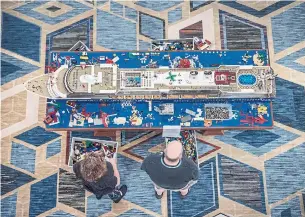  ??  ?? Guests build a scale model of the ship out of Lego blocks on the JoCo Cruise.