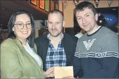  ?? (Pic: John Ahern) ?? GENEROUS GESTURE FROM PT-TO-PT COMMITTEE: Kieran O’Donovan, vice chairman of Kilworth & Araglin point-to-points and recently elected chairman of Araglin Carnival committee, making a financial contributi­on to Michelle Browne and Sean O’Grady at last Saturday night’s quiz in Christy’s.