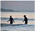  ??  ?? Calm mornings meant swimmers enjoyed a sunrise dip at Boscombe beach, Dorset