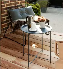  ?? ?? ABOVE Perfect for breakfast or coffee on a sunny day. Feolin cafe table, from £7,250; Otey dining side chairs, from £5,350 each, McKinnon and Harris
LEFT Pairing items together in a similar colour palette helps a townhouse garden appear larger.
Outdoor Bistro garden tray table, £20, Nöa & Nani