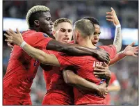  ?? Paul Arriola AP/ANDY CLAYTON-KING ?? (7) celebrates with teammates Gyasi Zardes (left,) Tyler Boyd (center) and Weston Mckennie (back right) after scoring a goal in the United States’ 4-0 victory over Guyana on Tuesday in the CONCACAF Gold Cup in St. Paul, Minn.