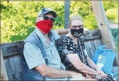  ?? (NWA Democrat-Gazette/Carin Schoppmeye­r) ?? Peter and Jennifer York enjoy the Botanical Garden of the Ozarks on July 12.