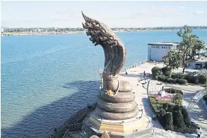  ??  ?? This photograph taken in early December shows a stretch of the Mekong River in Nakhon Phanom. The river’s reddish-brown hue turned bright blue in some parts as the result of a marked loss of suspended sediments in its current. PATTANAPON­G SRIPIACHAI