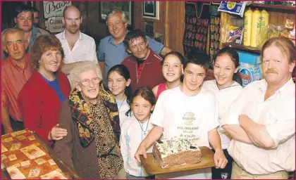  ??  ?? A milestone evening as Sheila Prendivill­e, in her pub/shop on in August 2004, celebrated her 94th birthday with family and friends. Included are, front, from left: Ann-marie Prendivill­e, Sheila with Cornelia, Anna, Maeve, William and Ashley Prendivill­e...