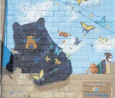  ??  ?? Artist Terri Palmer created a number of murals like this one on display Wednesday in Bangor.