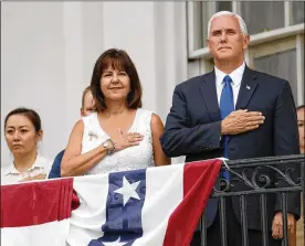  ?? ALEX BRANDON / ASSOCIATED PRESS ?? Vice President Mike Pence and his wife, Karen, stand on the Truman Balcony of the White House during the playing of the national anthem at the Fourth of July picnic for military families on the South Lawn.