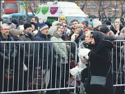  ?? REUTERS ?? People gather outside the church as they wait for a funeral service for Alexei Navalny in Moscow, Russia, on Friday.