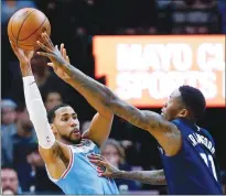  ??  ?? Minnesota Timberwolv­es Jamal Crawford pressures Sacramento Kings guard Garrett Temple during Sunday’s game in Minneapoli­s.