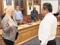  ?? Michael P. Mayko / Hearst Connecticu­t Media ?? Ansonia Mayor David Cassetti swears in Bobbi Tar to fill a vacancy on the Board of Education. A chaotic situation followed because the school board had sworn in its own candidate hours earlier. The dual appointmen­ts led to a lawsuit now pending in Superior Court.