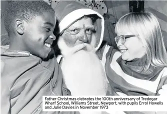  ??  ?? Father Christmas clebrates the 100th anniversar­y of Tredegar Wharf School, Williams Street, Newport, with pupils Errol Howells and Julie Davies in November 1973