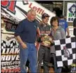  ?? PHOTO COURTESY KEN JOHNSON ?? Freddie Rahmer, center, pictured with parents Fred and Deb Rahmer, celebrates in victory lane after earning his second win at Williams Grove Raceway last Friday.