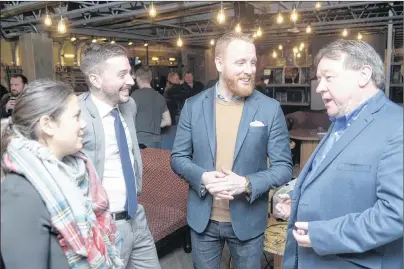  ?? MITCH MACDONALD/THE GUARDIAN ?? Charlottet­own Youth Matters board members, from left, Lydia Peters, Zac Murphy and Alex Youland chat with Mayor Clifford Lee following an event Tuesday night aimed at encouragin­g young Islanders to become more politicall­y engaged. The evening saw a...