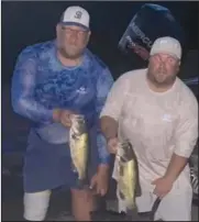  ?? ?? Bryce and Ryker Holt show their winning catch from the Thursday Night Jackpot.
Submitted Photo