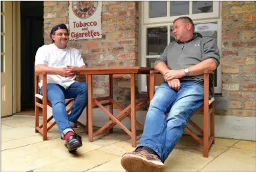  ?? Photo by Declan Malone ?? Manager of Bob Griffin’s Bar Normán Ó Conchúir (right) and his neighbour Nicky Foley of Solas Tapas whose innovative food and drink collaborat­ion got off to a busy start on Monday.