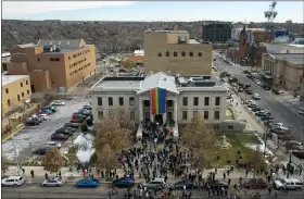  ?? BRITTANY PETERSON/THE ASSOCIATED PRESS ?? In this aerial image taken with a drone, a rainbow flag is unfurled at City Hall on Wednesday, Nov. 23, 2022, in Colorado Springs, Colo.