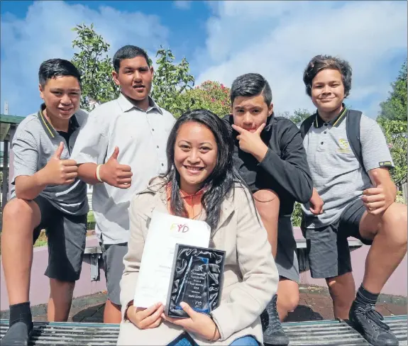  ??  ?? Excellence: Paris John, front, was awarded a Foundation for Youth Developmen­t Excellence Award for her work with year nines and they were behind her all the way. Pictured: Year 9 students Roman Reti-Mataiti, back left, Abraham Tuakana-Natua, Tikal...