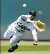  ?? D. Ross Cameron The Associated Press ?? Athletics center fielder Dustin Fowler prepares to catch a ball hit by Nick Ahmed in the eighth inning of the Diamondbac­ks’ 3-0 loss Saturday at Oakland Coliseum.