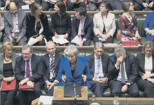  ?? PICTURE: MARK DUFFY/UK PARLIAMENT ?? HANGING ON: Prime Minister Theresa May facing questions from Labour leader Jeremy Corbyn in the House of Commons.