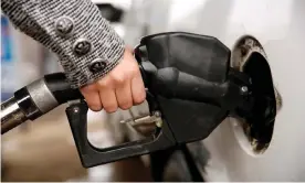  ??  ?? ‘The gas pump stickers will remind drivers to think about climate change and hopefully consider non-polluting options,’ said a City of Cambridge spokesman. Photograph: Kevin Lamarque/Reuters