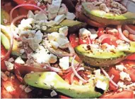  ?? jsonline.com/food. ANGELA PETERSON/ JOURNAL SENTINEL ?? Heirloom tomato salad with feta is a colorful addtion to a salad buffet. More food coverage at