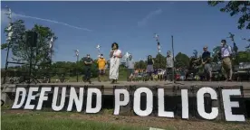  ?? Photograph: Jerry Holt/AP ?? Alondra Cano, a city council member, speaks at Powderhorn Park on Sunday.