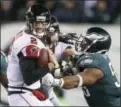  ?? CURTIS COMPTON/ATLANTA JOURNALCON­STITUTION VIA AP ?? Philadelph­ia Eagles defensive end Brandon Graham sacks Atlanta Falcons quarterbac­k Matt Ryan during the second half Saturday, in Philadelph­ia.