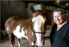  ?? NWA Media/ANTHONY REYES ?? Debbie Studyvin, operations manager of Horses for Healing, grew up with friends who were kept from horseback riding because of a disability. She helped start Horses for Healing to help more children feel included.