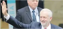  ??  ?? Leader Jeremy Corbyn acknowledg­es supporters as he leaves Labour Party headquarte­rs in London on Friday.