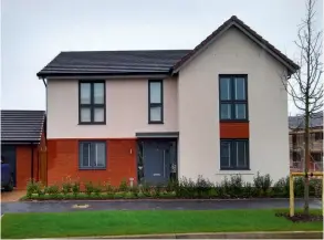  ??  ?? Below: A neutral Ecorend modern render breaks up the bright red brickwork of this new home