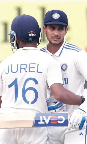  ?? — REUTERS ?? India’s Shubman Gill and Dhruv Jurel celebrate after the match.