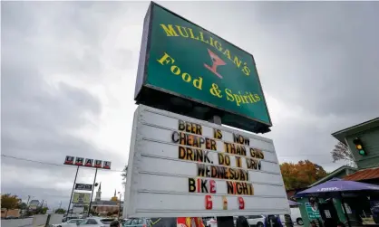  ?? ?? Alcohol is one thing whose price has fallen recently: a bar in Marietta, Georgia, claims its beer is cheaper than gasoline. Photograph: Erik S Lesser/EPA