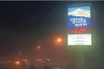  ?? ERIC ENGMAN, AP ?? A bank sign in Fairbanks, Alaska, reflects the frigid temperatur­es that have enveloped the state this week.