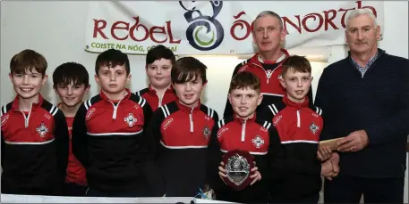  ?? Photo by John Tarrant ?? Dromtariff­e U-12 hurlers who are Rebel Og North Cork League winners pictured with Denis Guiney, Rebel Óg, North Cork at the presentati­on of medals in Mallow.